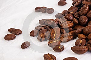 Natural background for Cafe menu or brochure template - macro photo of brown roasted coffee beans, close up