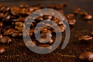 Natural background for Cafe menu or brochure template - macro photo of brown roasted coffee beans, close up