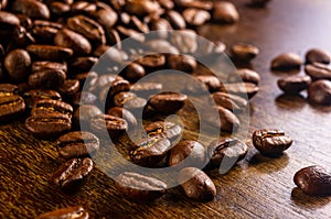 Natural background for Cafe menu or brochure template - macro photo of brown roasted coffee beans, close up