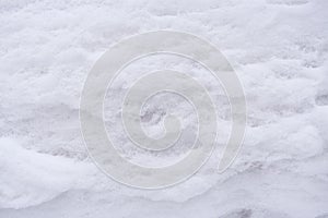 Natural background. Close-up white porous, friable snowy surface.