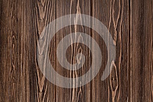 Natural background from larch boards. Textured wood surface. Dark brown color