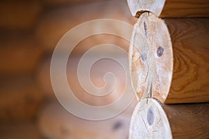 Natural background pattern of log wall. Construction of houses made of wood, rounded timber