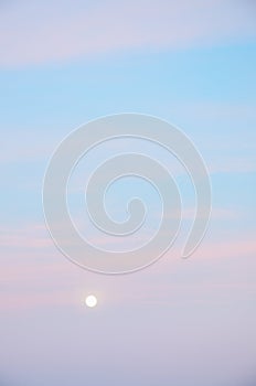 Natural background of pink blue sky with moon.