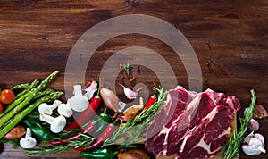 Natural background with raw beef, vegetables