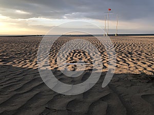Natural background: Ribbed sand in early morning light on Grado beach