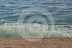 sandy beach and blurred turquoise sea in sunny sparks. Alboran, Benalmadena, Andalusia, Spain A natural background photo