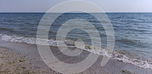 Natural background: sea waves roll ashore