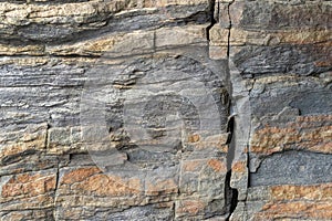 Natural background. Texture of cracked slate stone with corrosion pattern