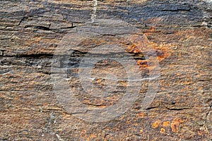 Natural background. Texture of slate stone layers with rusty pattern