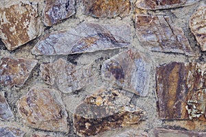 Natural backgrounds of colored stones with round and square shape on the wall, use for outdoors decoration