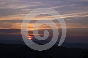 Natural backgrounds of the sunset view with the evening sky on the mountain in the winter.