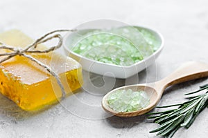 Natural bath salt with rosemary on stone table background