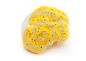 Natural bath sea sponge with soap isolated on white.