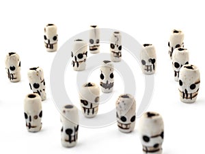 Natural beads skull from carved bone on white background