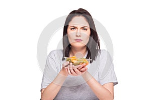 natural beautiful young woman heaving a healthy fruit meal, isolated on white