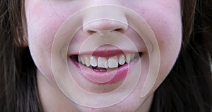 natural beauty close-up of girl's mouth smiling sincerely even white teeth frequency natural lips space for text