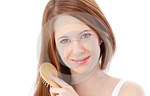 Natural beauty combing hair smiling photo