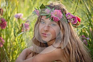 Natural beauty and health, woman with flowers in hair. photo