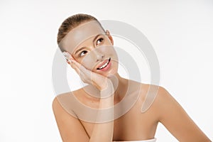 Natural Beauty Portrait. Beautiful Spa Woman smiling isolated over white background. Perfect Fresh Nude Skin