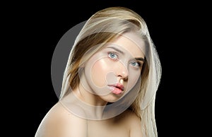 Natural beauty. Portrait of beautiful young woman with shiny blonde straight long hair, with Clean Fresh Skin look away