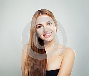 Natural beauty. Young female face portrait. Model with healthy hair and clear skin on white background