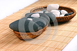 Natural bebbles on the rattan background