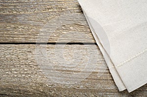 Natural beige cotton cloth on wooden table