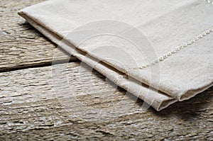 Natural beige cotton cloth on wooden table