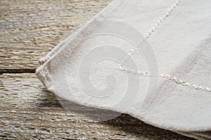 Natural beige cotton cloth on wooden table