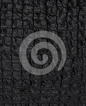 Natural black charcoal texture for backgrounds. Top view