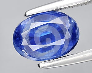 natural blue kyanite gem on the background