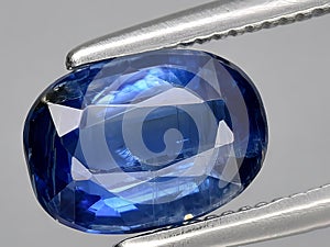 natural blue kyanite gemstone on the background