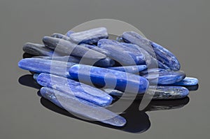 Natural blue kyanite stones on dark background