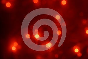 Natural bokeh holiday lights background bright lights red