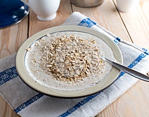 Natural breakfast with a fresh yogurt, oats and pureed apple