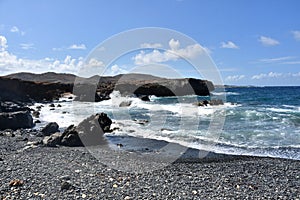 Natural Bridge on Black Stone Beach in Aruba