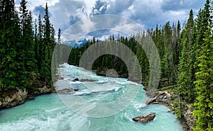 Natural Bridge in Canadian rocky mountain. A natural rock formation and flow of the Kicking Horse River in British Columbia