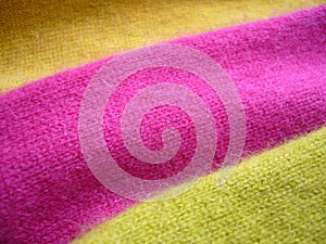 Natural bright knitted fabric of different colors. Bright sweaters, cashmere fabrics, wool.
