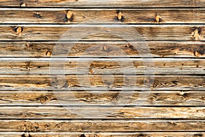 Natural brown barn wood wall. Wooden textured background pattern.