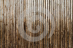 Natural brown barn wood wall. Wooden textured background pattern.