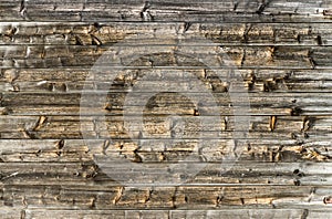 Natural brown barn wood wall. Wooden textured background pattern.