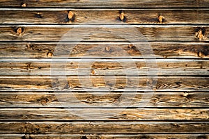 Natural brown barn wood wall. Wooden textured background pattern.