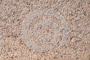 Natural brown granite surface texture, background.