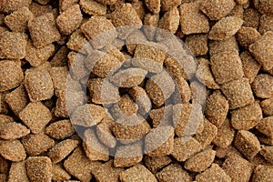 Natural brown texture of dry square cat food