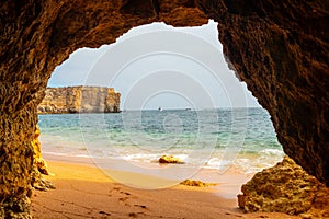 Natural cave in the Algarve on the beach at Praia da Coelha, Albufeira, Portugal