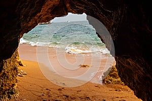 Natural cave in the Algarve on the beach at Praia da Coelha, Albufeira, Portugal