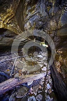 Natural cave with a light at the end of the tunnel