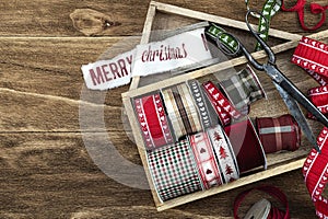 Natural Christmas background with christmas ribbons and antique scissorson.