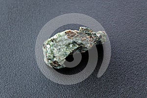 Natural chrysolite, olivine green color transparent raw crystal, close up