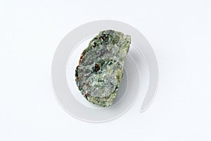 Natural chrysolite, olivine green color transparent raw crystal, close up, white background